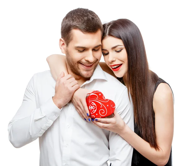 Young beautiful couple with present isolated on white — Stock Photo, Image