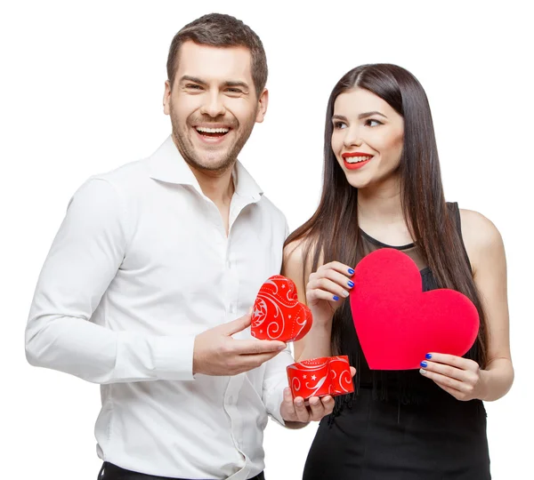 Young beautiful couple with present isolated on white — Stock Photo, Image