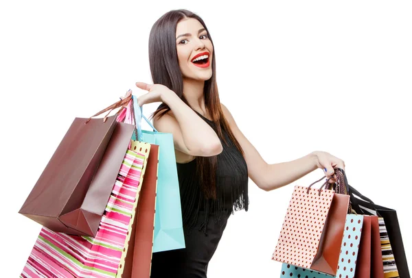 Retrato de la joven feliz mujer sonriente con bolsas de compras — Foto de Stock