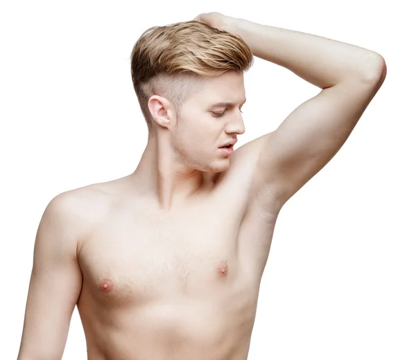 Stilig ung man sniffar hans armhåla — Stockfoto