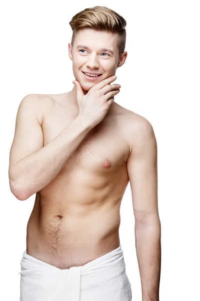 Hombre joven sin camisa aislado en blanco — Foto de Stock