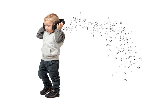 Malé dítě s sluchátka — Stock fotografie