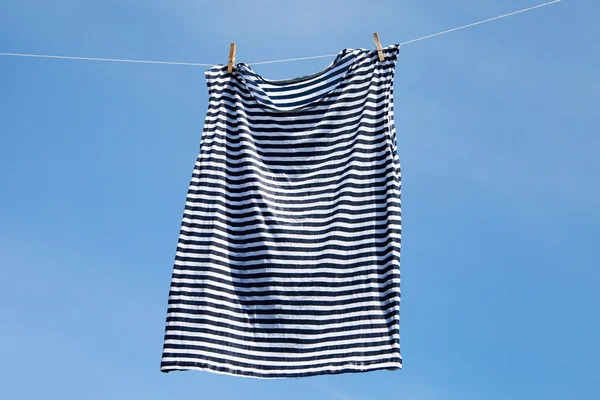 Drying of striped shirt. — Stock Photo, Image