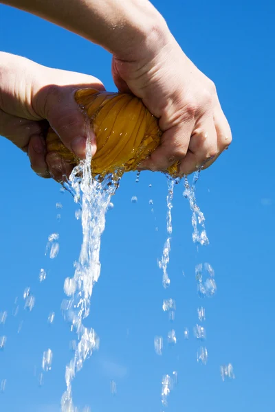 Wet fabric against blue sky. — Stock Photo, Image