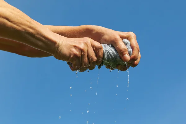 Squeezing of cloth. — Stock Photo, Image