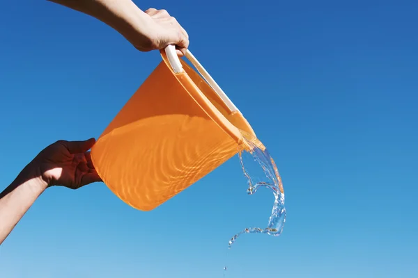 Images: pouring bucket of water | Pouring Water Bucket Blue Sky — Stock