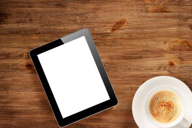 Pad pc ve ahşap masa kahve