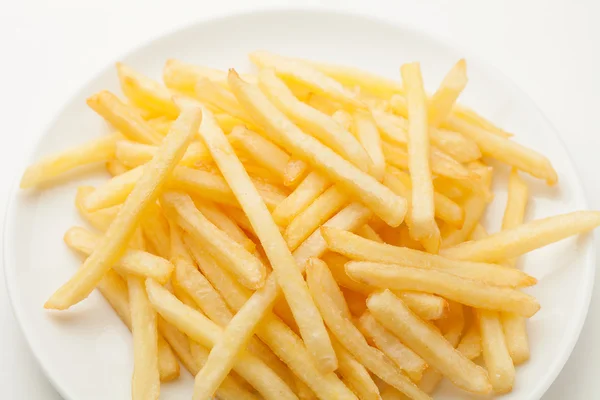 Patate fritte su un piatto bianco — Foto Stock