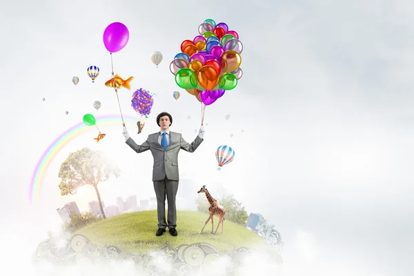 Humorous guy with balloons — Stock Photo, Image