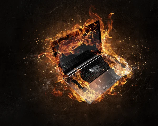 Laptop burning with fire — Stock Photo, Image