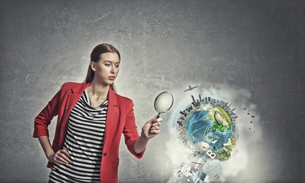 Girl using magnifier for search — Stock Photo, Image