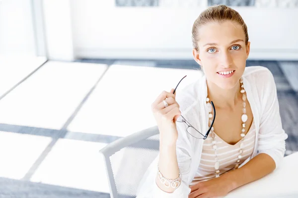 Attractive office worker sitting at desk — Stock Photo, Image