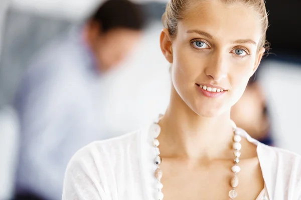 Attractive female worker in office — Stock Photo, Image