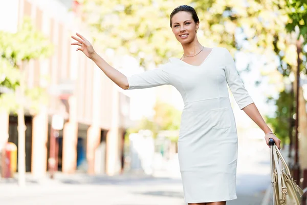 Business woman pulling suitcase bag walking in city — Stock Photo, Image