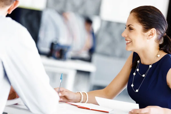 Attractive female worker in office — Stock Photo, Image