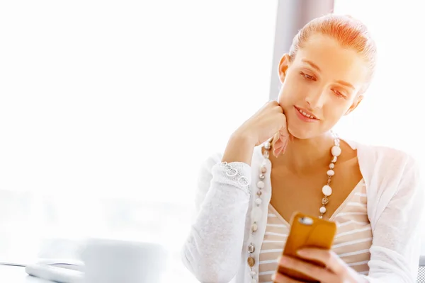 Attractive office worker sitting at desk — Stock Photo, Image