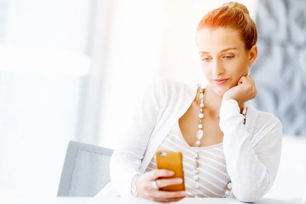 Attractive office worker sitting at desk — Stock Photo, Image