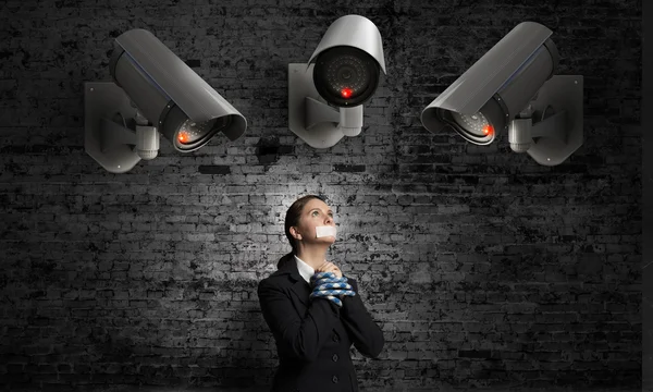 Camera keep an eye on woman — Stock Photo, Image