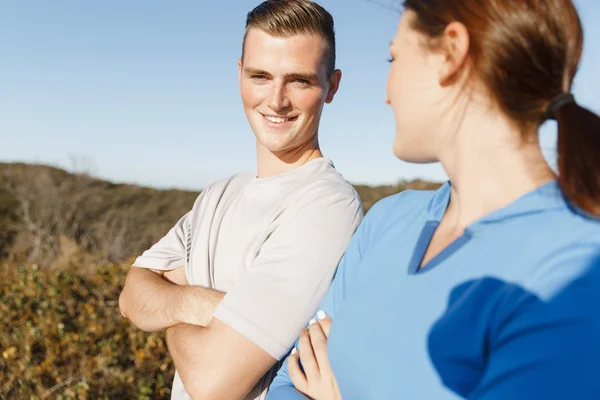 Young couple on beach training together — Stock Photo, Image