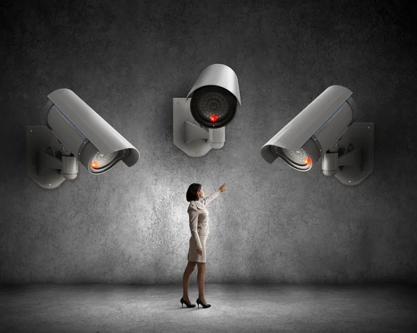 Camera keep an eye on woman — Stock Photo, Image