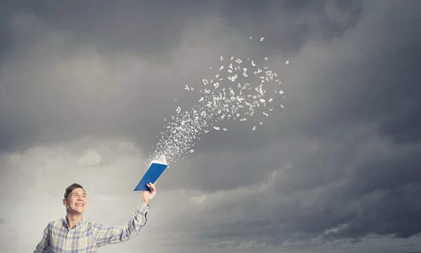 Man with book in hand — Stock Photo, Image