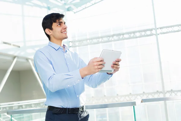 Businessman leaning on balcony railings Royalty Free Stock Photos