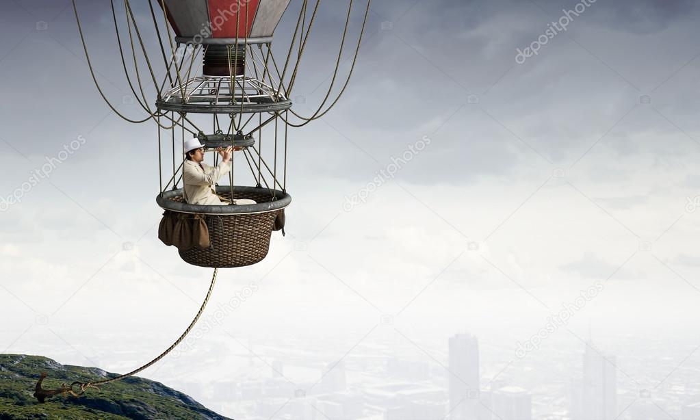 Man travel in aerostat