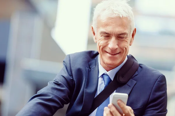 Successful businessman riding bicycle — Stock Photo, Image