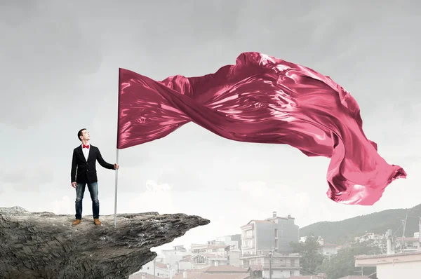 Man with red waving flag — Stock Photo, Image