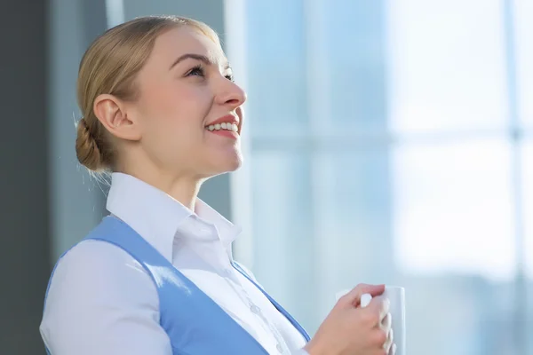 Attractive woman in office building — Stock Photo, Image