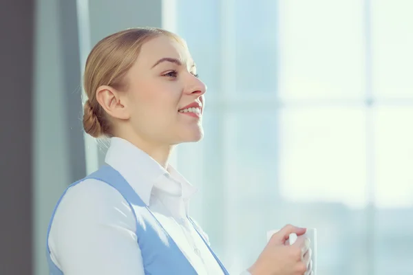 Attractive woman in office building — Stock Photo, Image