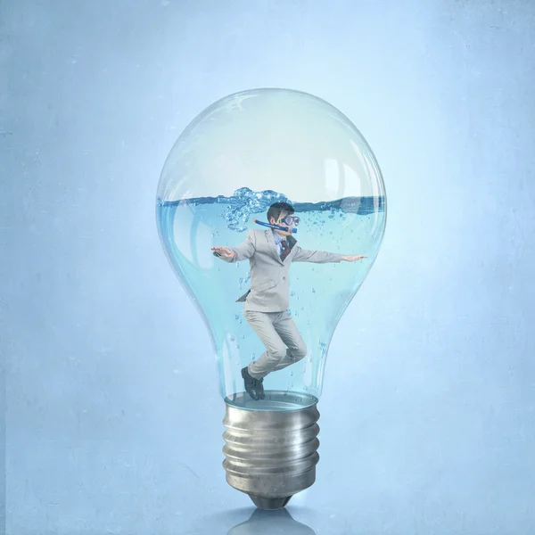 Businessman diver in bulb — Stock Photo, Image