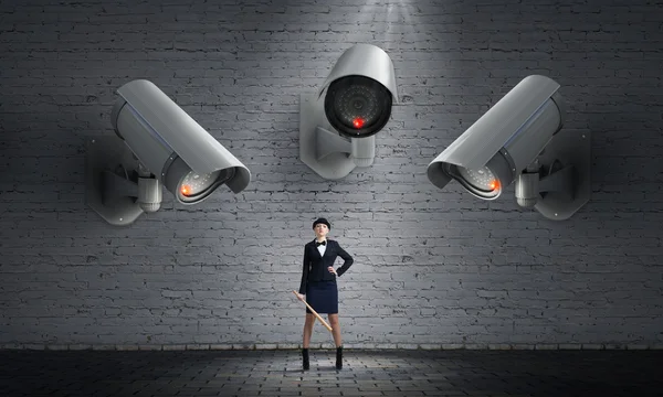 Camera keep an eye on woman — Stock Photo, Image