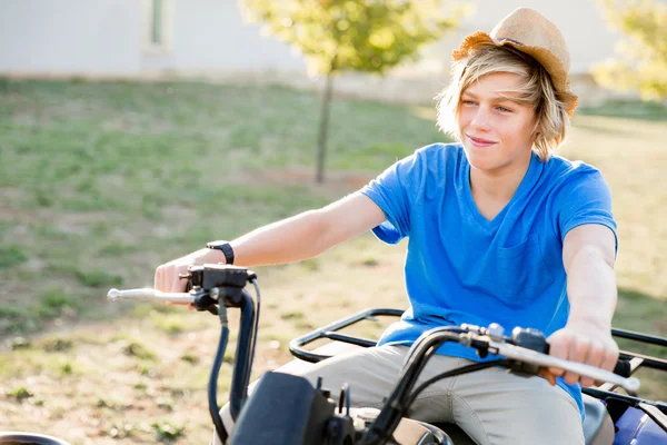 Boy riding farm truck in vineyard — Stock Photo, Image