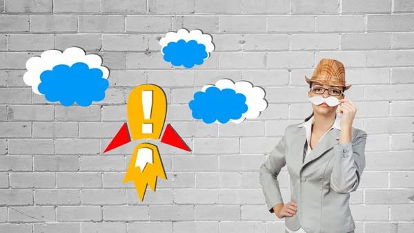 Businesswoman trying paper mustache — Stock Photo, Image