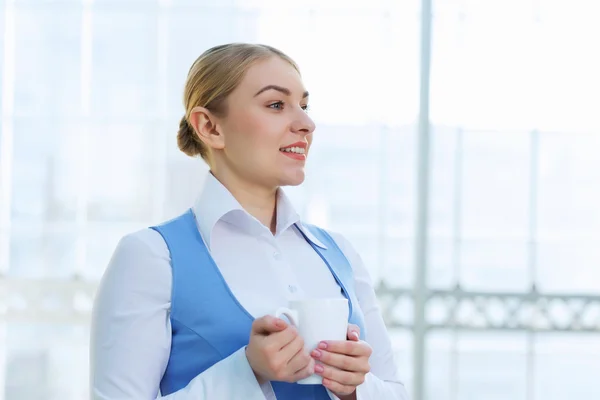 Attractive woman in office building — Stock Photo, Image