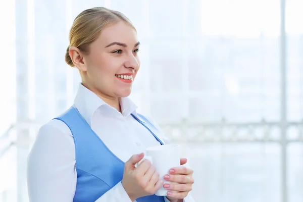 Attractive woman in office building — Stock Photo, Image