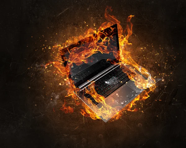 Laptop burning with fire