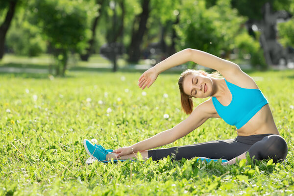 Girl practicing stretching exercises