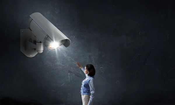 Camera keep an eye on woman — Stock Photo, Image