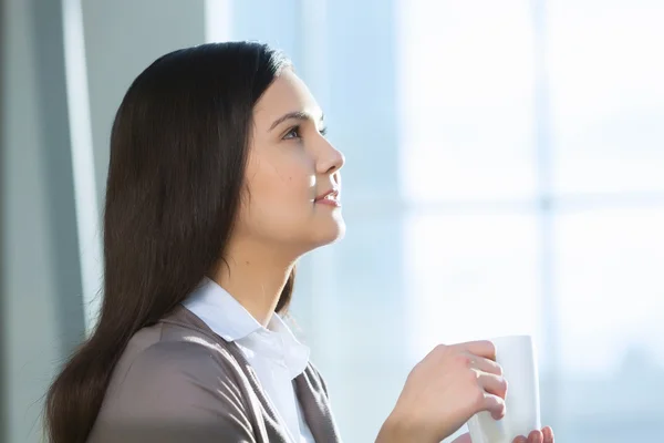 Attractive woman in office building — Stock Photo, Image