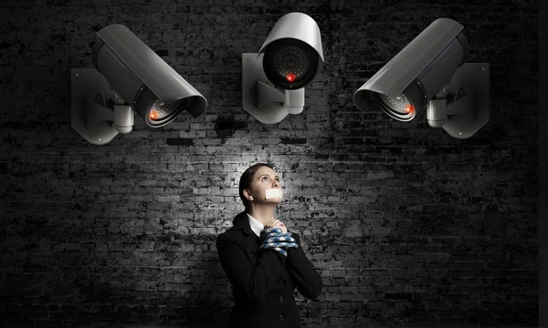 Camera keep an eye on woman — Stock Photo, Image