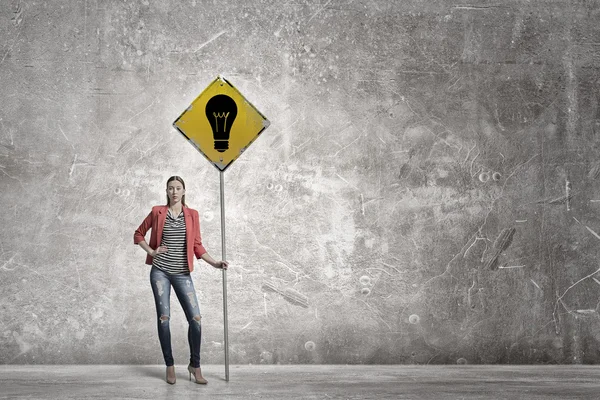 Pretty girl in concrete room — Stock Photo, Image