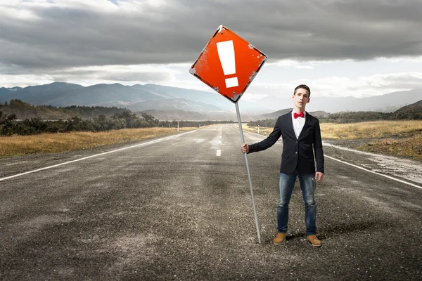 Guy showing roadsign — Stock Photo, Image