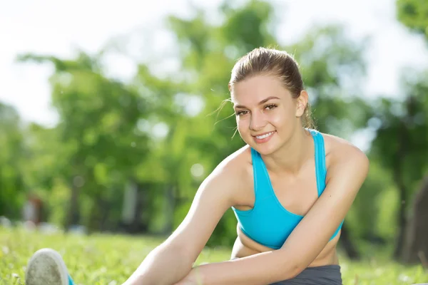 Girl practicing stretching exercises Stock Photo