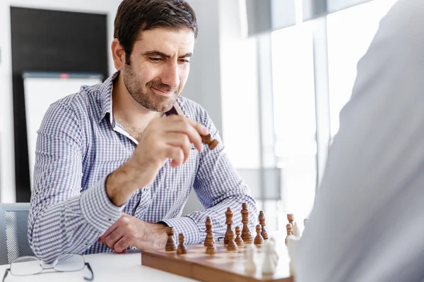 Portrait of two young man playing chess — Stock Photo, Image