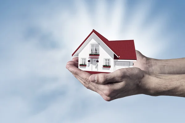 House in human hand — Stock Photo, Image