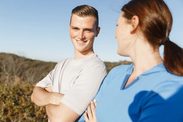 Young couple on beach training together — Stock Photo, Image