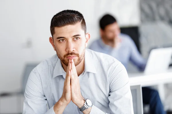 Attractive office worker sitting at desk — Stock Photo, Image