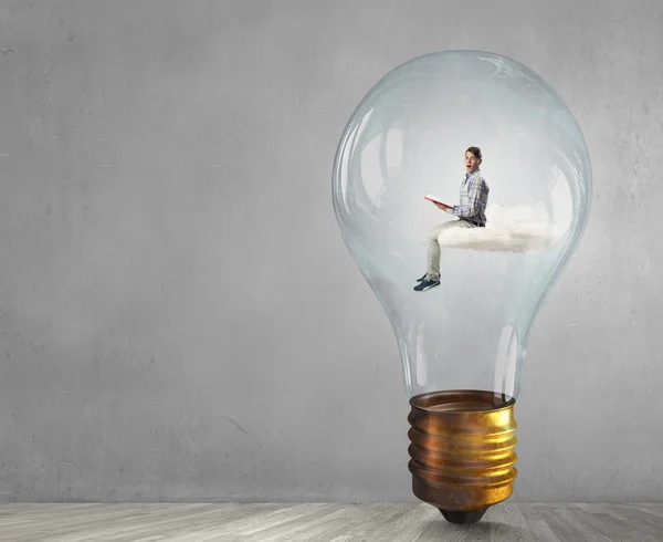 Man in electric bulb — Stock Photo, Image